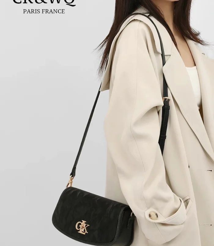 Textured PU shoulder bag for women worn crossbody by a model