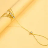 Gold and Silver Three-Layer Finger Bracelet displayed flat showing the connected chain design.