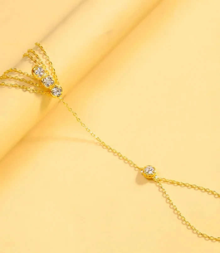 Gold and Silver Three-Layer Finger Bracelet displayed flat showing the connected chain design.
