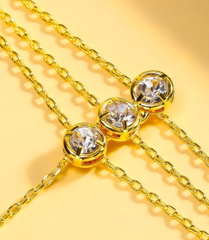 Gold and Silver Three-Layer Finger Bracelet close-up highlighting the brilliant round crystal details.