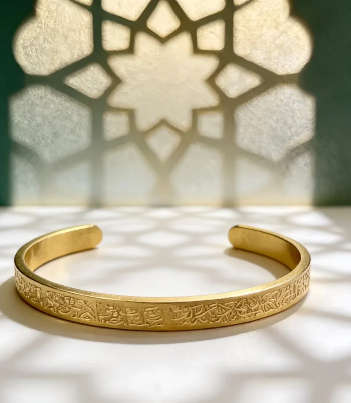 Vintage embossed stainless steel cuff bracelet gold color showing inner diameter measurements.
